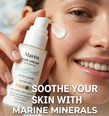 A close-up of a woman applying Marèn Tide Cream moisturizer to her cheek, showcasing the lightweight gel-cream texture infused with marine minerals and niacinamide for soothing acne-prone skin.
